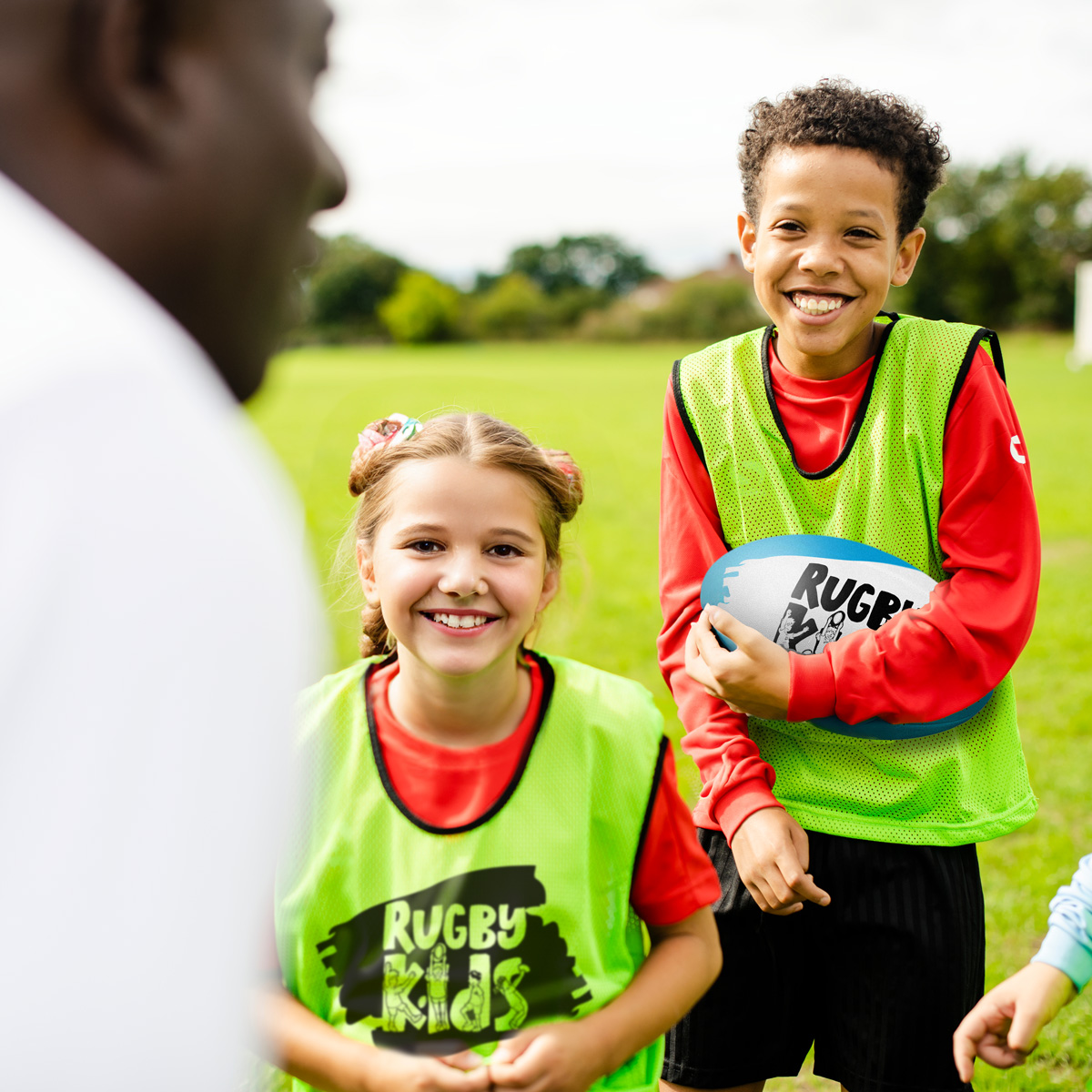 Children learning about rugby in a RugbyKids after-school club