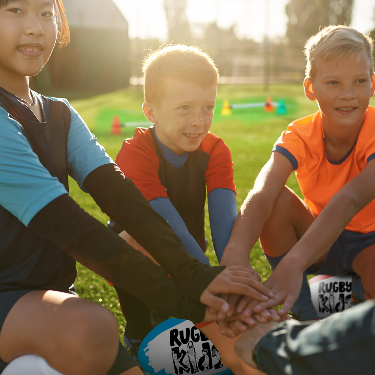 Children doing a teamwork exercise in a RugbyKids after-school club